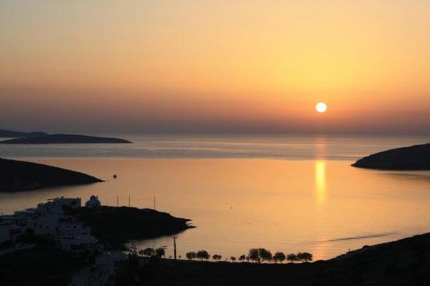 a sunset over a body of water with the sun setting at Beach House LIPSI Island (Katsadia Beach) in Lipsoi