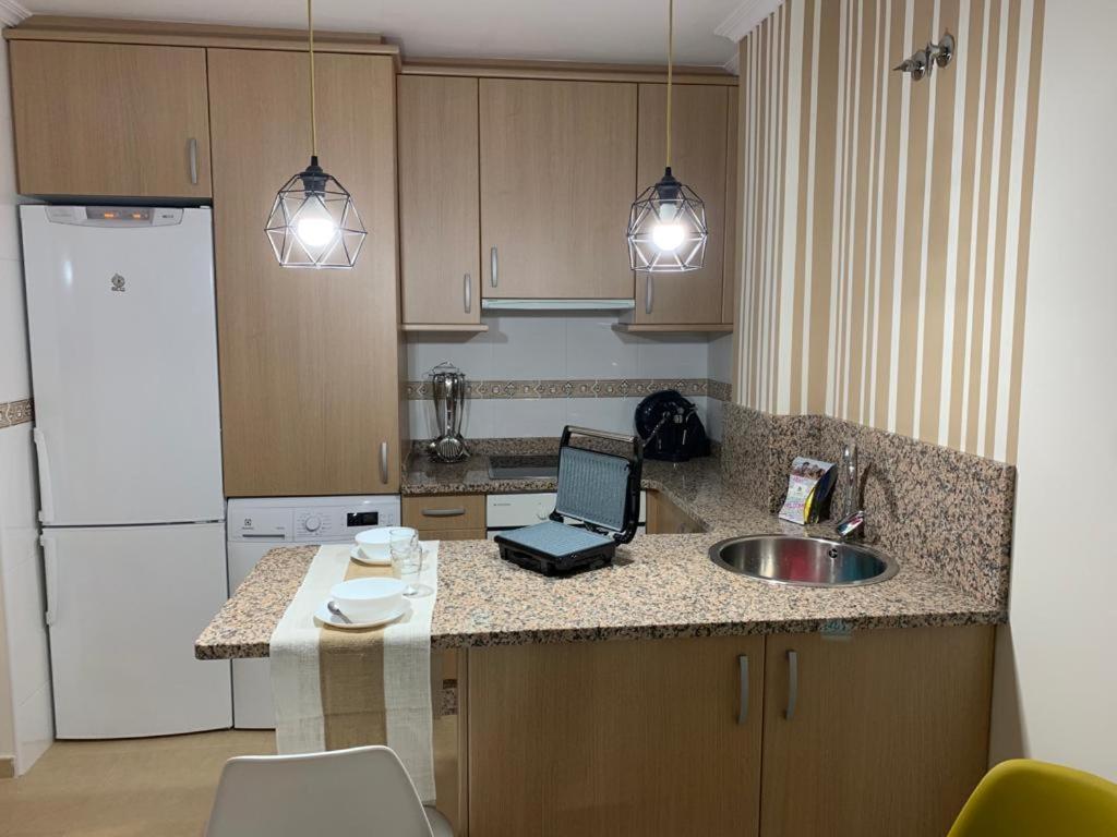 A kitchen or kitchenette at A&M Burela Costa