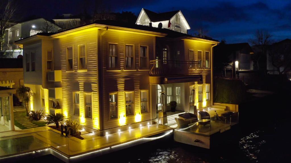 a house lit up at night with lights at YALI BOSPHORUS in Istanbul