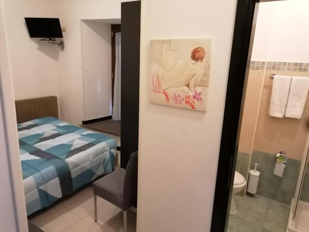 Postel nebo postele na pokoji v ubytování Hotel Centrale