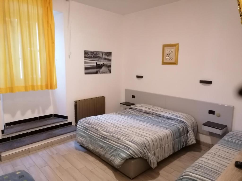 Postel nebo postele na pokoji v ubytování Hotel Centrale