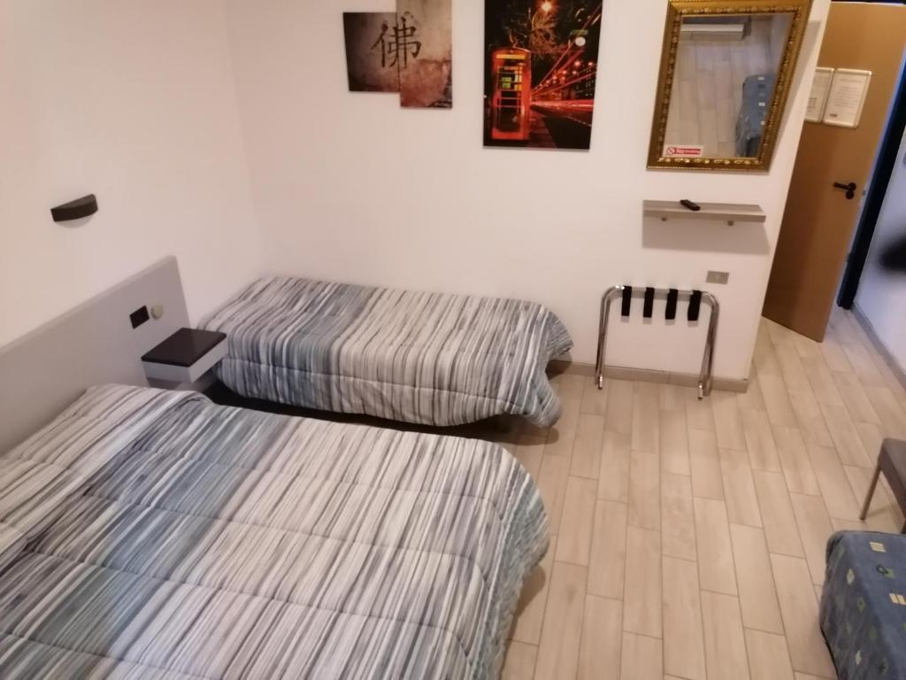 Postel nebo postele na pokoji v ubytování Hotel Centrale