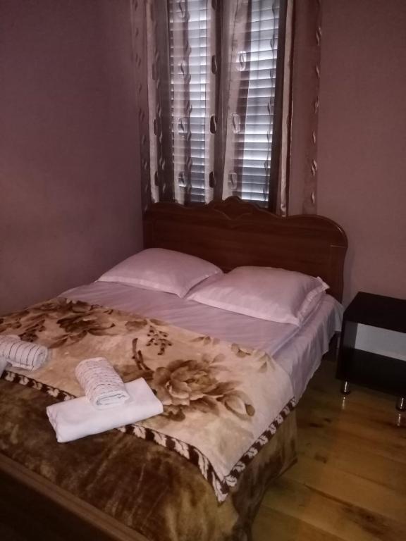 Llit o llits en una habitació de Maya Guest House