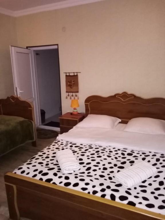Llit o llits en una habitació de Maya Guest House