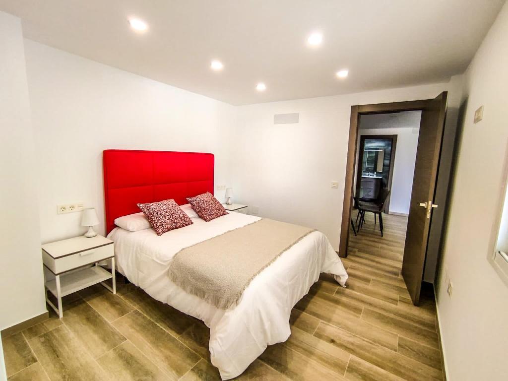 Posteľ alebo postele v izbe v ubytovaní Apartamentos La Libertad 1