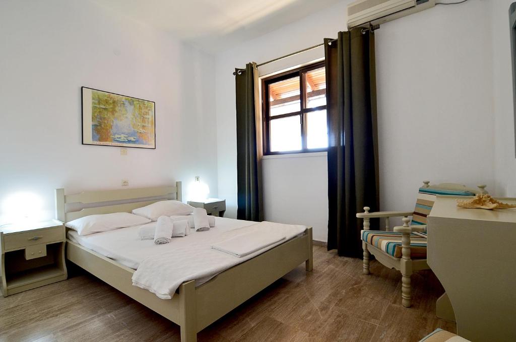 Postel nebo postele na pokoji v ubytování Soulis Hotel