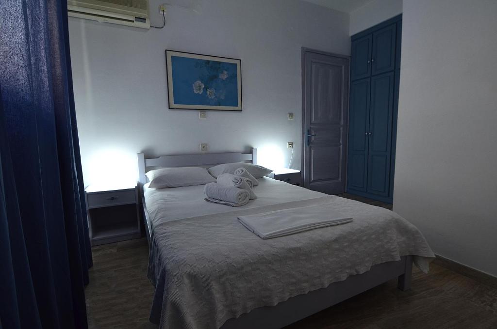 Postel nebo postele na pokoji v ubytování Soulis Hotel