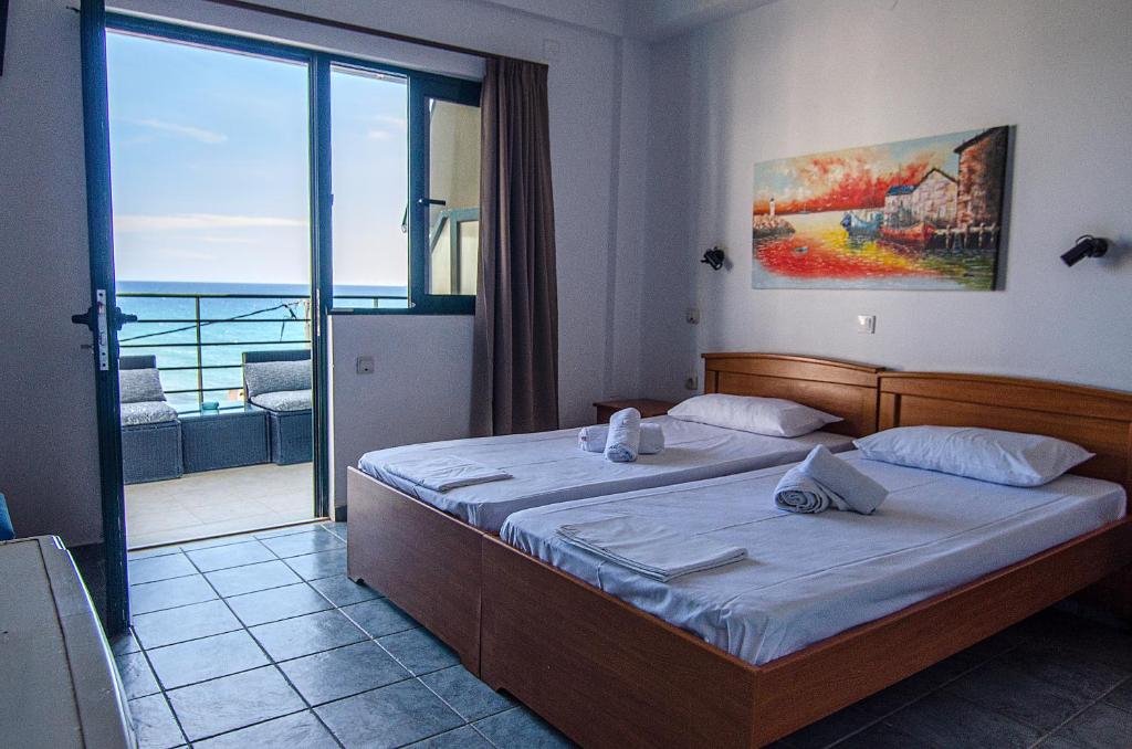 Postel nebo postele na pokoji v ubytování Soulis Hotel