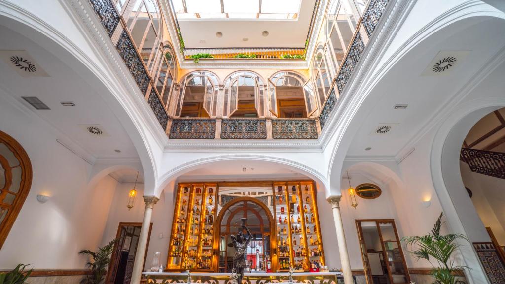 a view of the lobby of a building at Hotel Alabardero in Seville