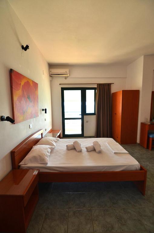 Postel nebo postele na pokoji v ubytování Soulis Hotel