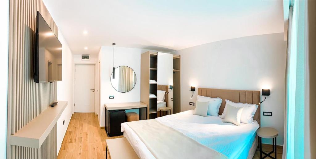 Postel nebo postele na pokoji v ubytování Hotel Corina