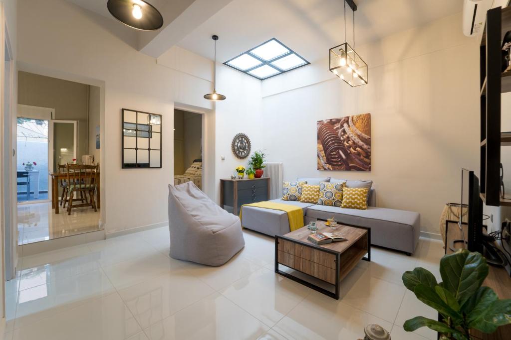 a living room with a couch and a table at Lucas Apartment in Lixouri