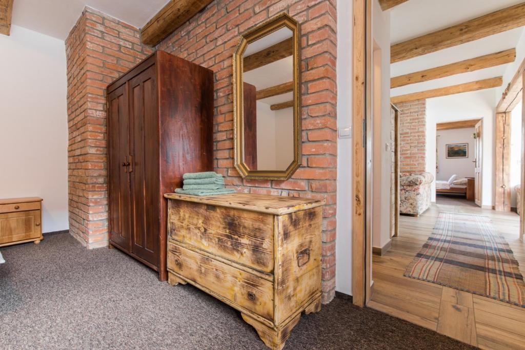 A bed or beds in a room at Chalupa u Kova