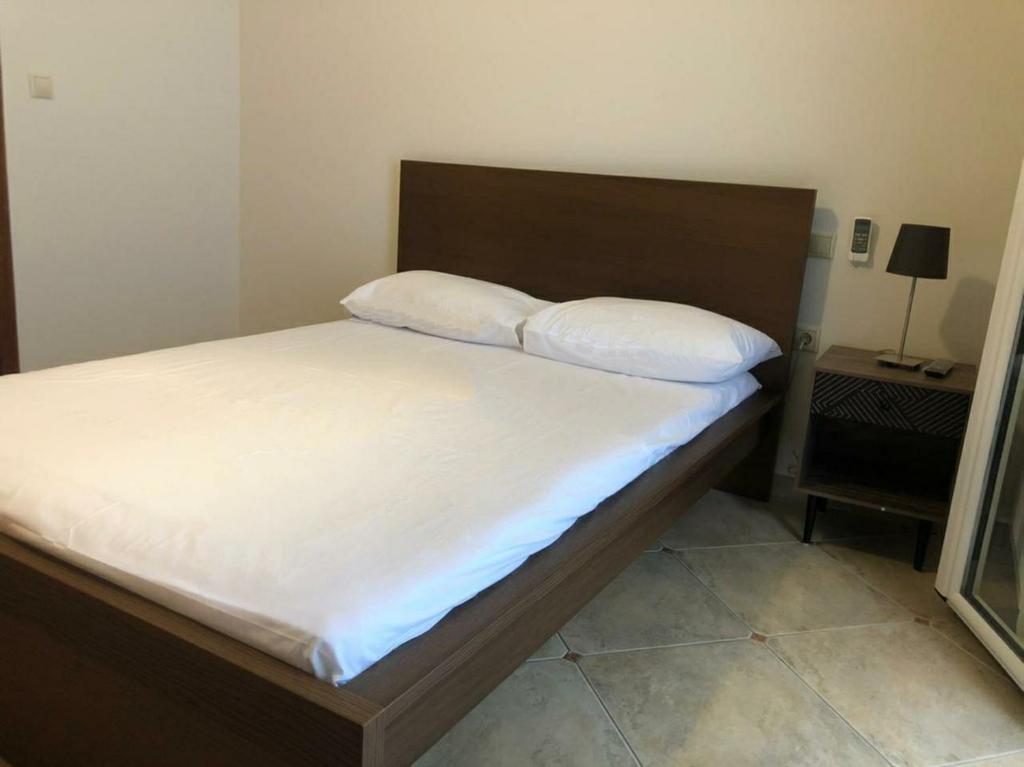 Posteľ alebo postele v izbe v ubytovaní Melina Apartment