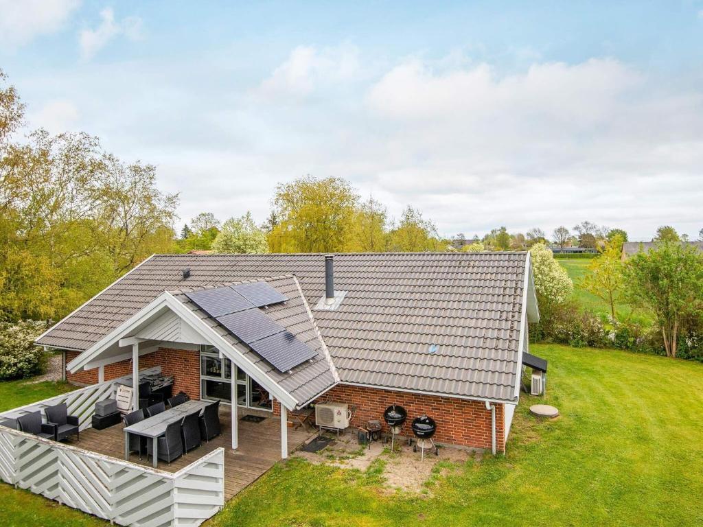 an aerial view of a house with solar panels on the roof at 10 person holiday home in Juelsminde in Sønderby