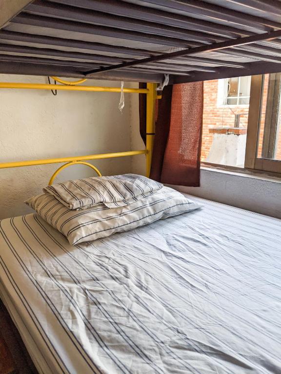 Postel nebo postele na pokoji v ubytování Chanclas Hostel Vallarta