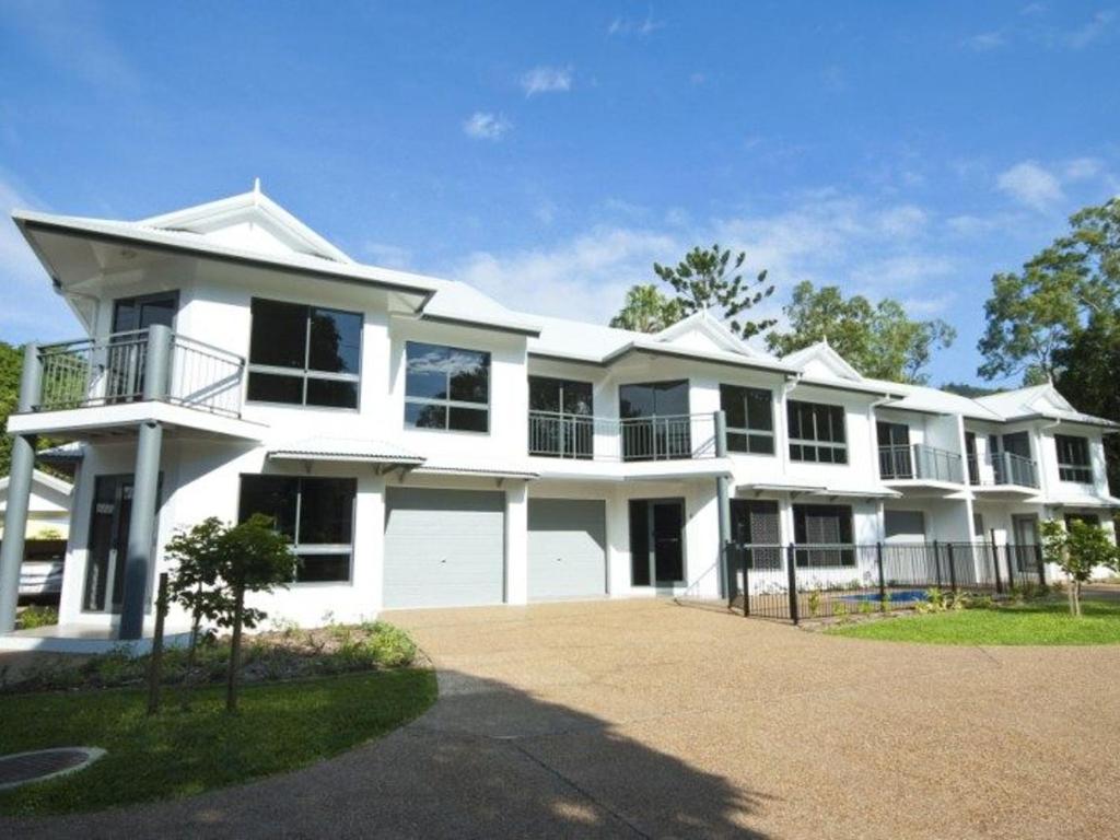 a large white house with a lot of windows at Woodville Beach Townhouse 6 in Arcadia