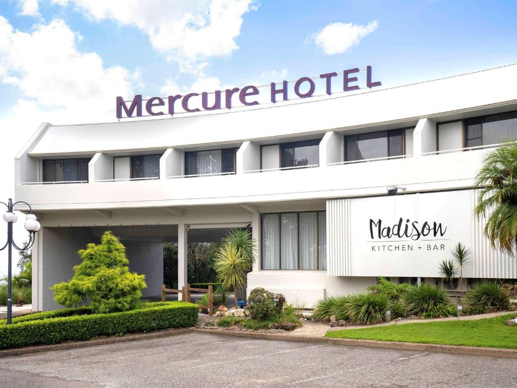 a hotel with a sign on the front of it at Mercure Charlestown in Newcastle