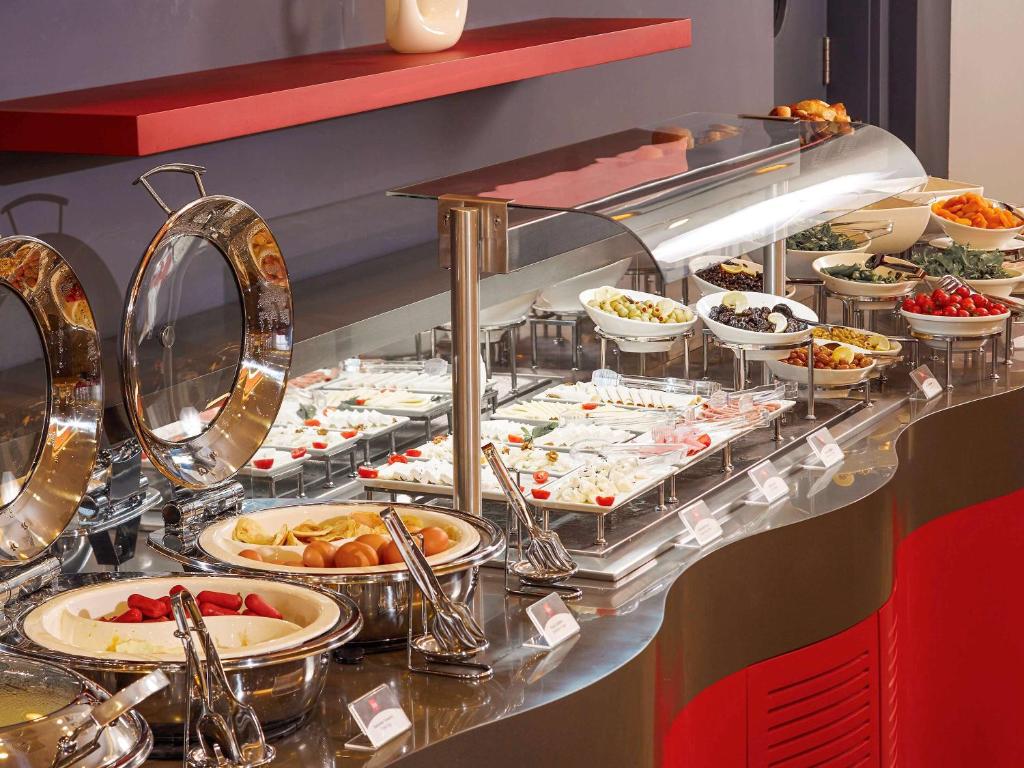 a buffet line with many plates of food at ibis Ankara Airport Hotel in Ankara