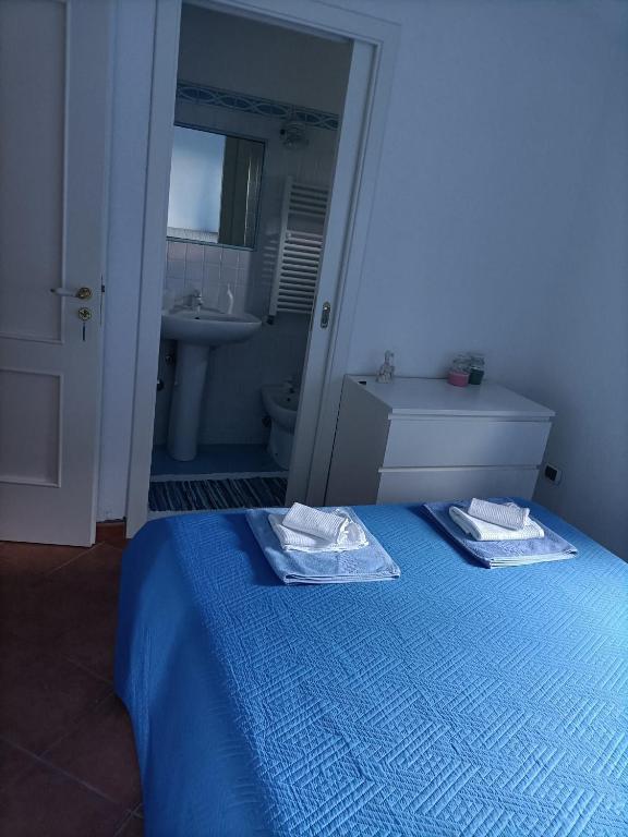 Postel nebo postele na pokoji v ubytování Il carrubo B&b