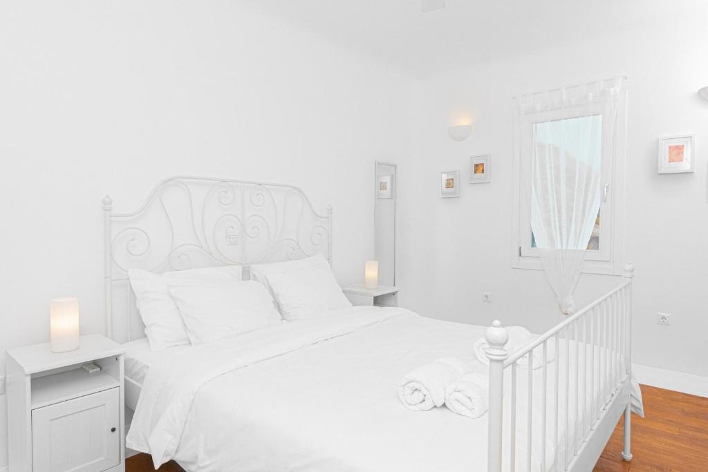 Posteľ alebo postele v izbe v ubytovaní Tranquil Villas by Whitelist Mykonos