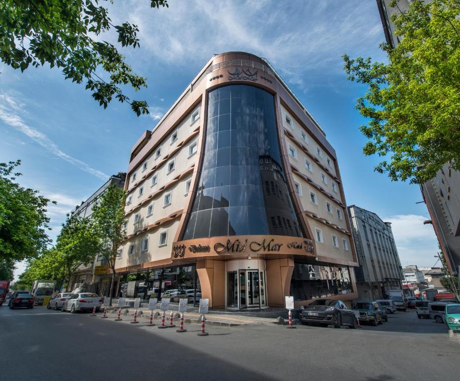 a building on a street with cars parked in front of it at MidMar Deluxe Hotel in Istanbul