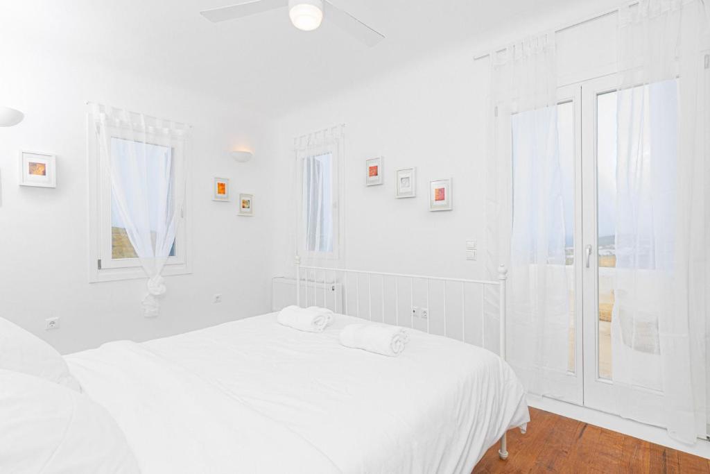 Posteľ alebo postele v izbe v ubytovaní Tranquil Villas by Whitelist Mykonos