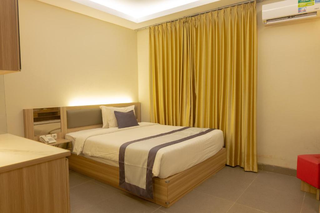 Postel nebo postele na pokoji v ubytování @K Hotel