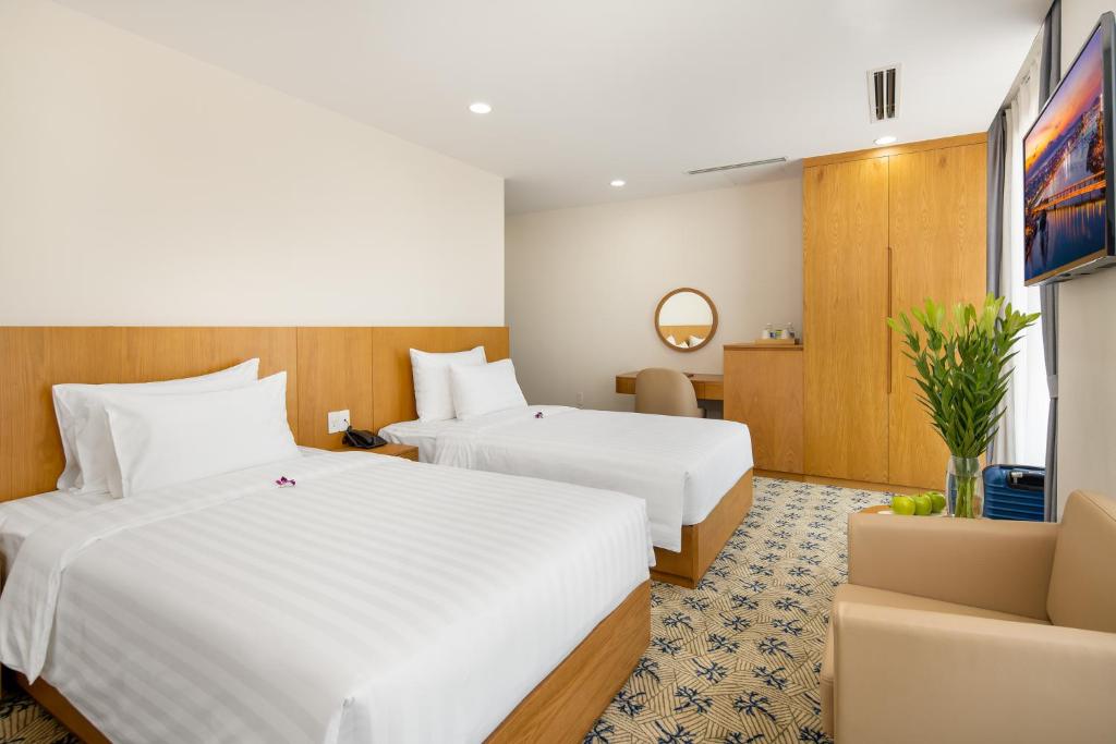 Postel nebo postele na pokoji v ubytování Lamanga Hotel & Suites