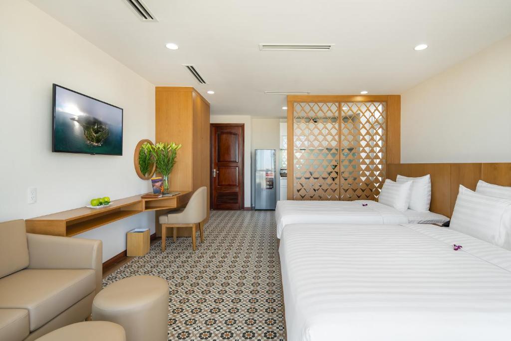 Postel nebo postele na pokoji v ubytování Lamanga Hotel & Suites