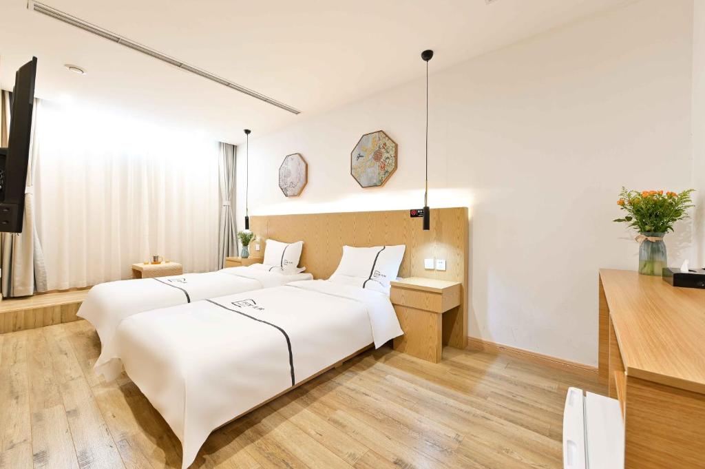 Xingshe Alley Courtyard Hotel Beijing Wangfujing Forbidden City Branch - Li Yuan Deluxe Zweibettzimmer