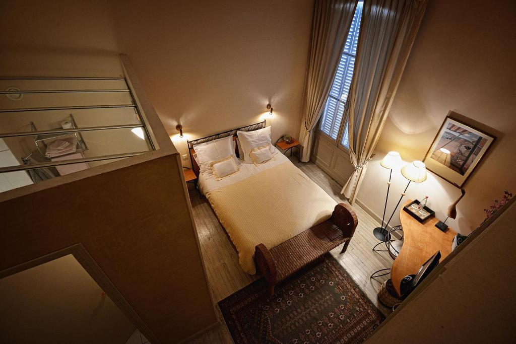 Postel nebo postele na pokoji v ubytování Hotel Le Clos Raymi