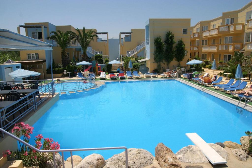 a large blue swimming pool in a resort at Futura Hotel in Maleme