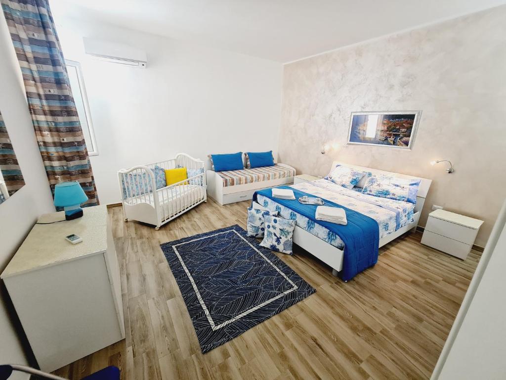 Ένα ή περισσότερα κρεβάτια σε δωμάτιο στο V & V case vacanze