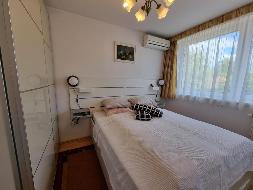 Postel nebo postele na pokoji v ubytování Abigél Vendégház