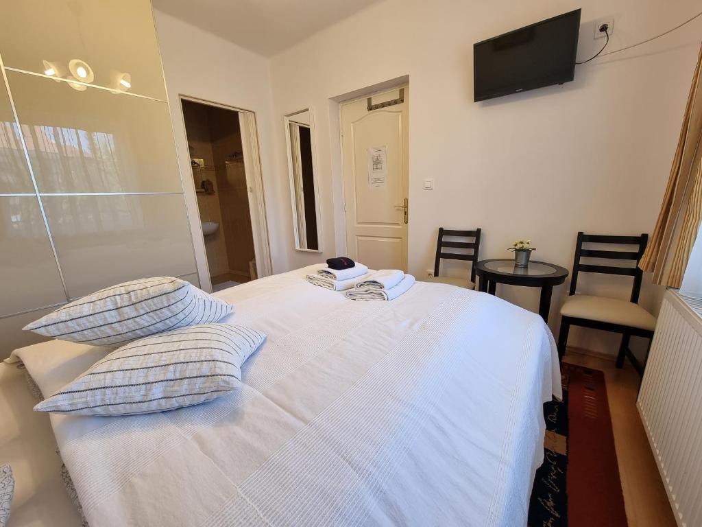 Postel nebo postele na pokoji v ubytování Abigél Vendégház