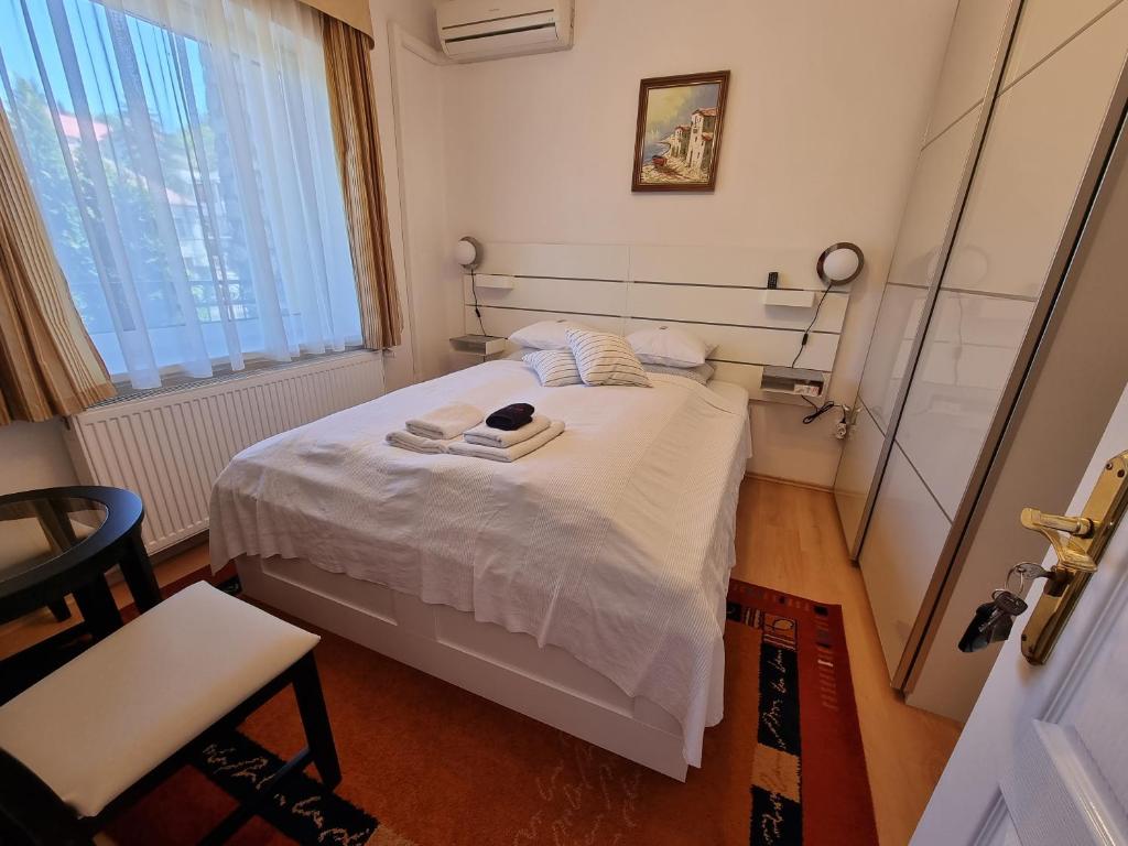 Postel nebo postele na pokoji v ubytování Abigél Vendégház