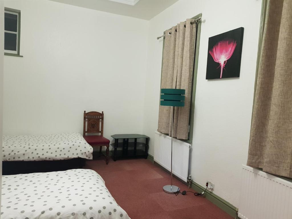 Postel nebo postele na pokoji v ubytování Costa Suite