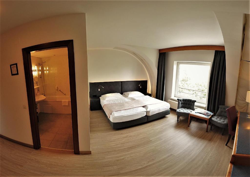Voodi või voodid majutusasutuse Skycity Hotel Atrigon toas
