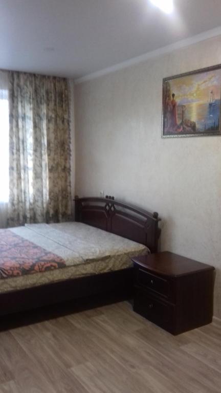 Кровать или кровати в номере Apartment on Lenina 128
