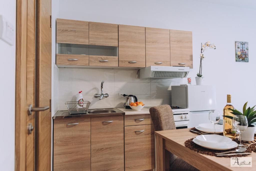 Kuchyň nebo kuchyňský kout v ubytování Relax Apartment - Ada