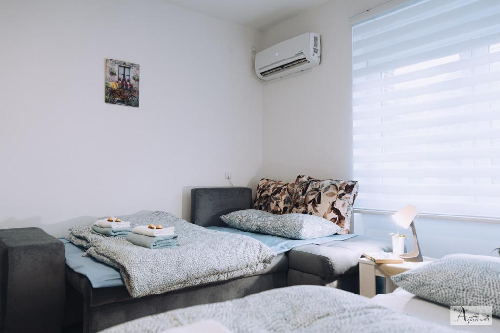 Postel nebo postele na pokoji v ubytování Relax Apartment - Ada