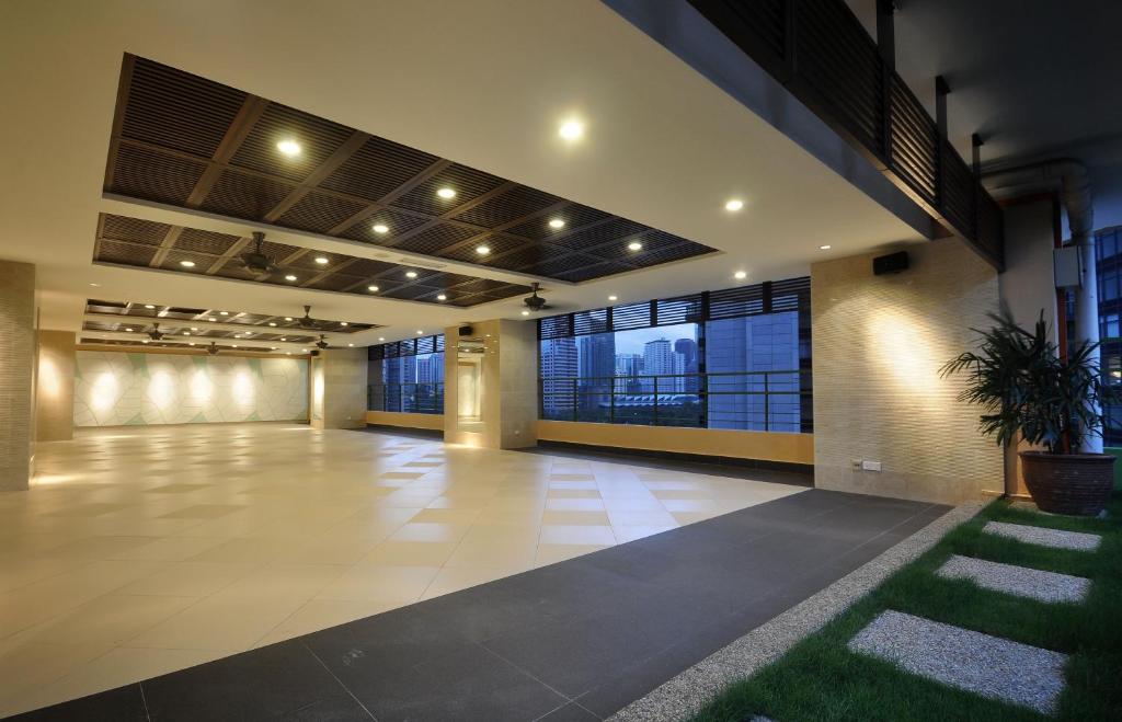 A spacious entrance lobby with large windows and a landscaped indoor edge.
