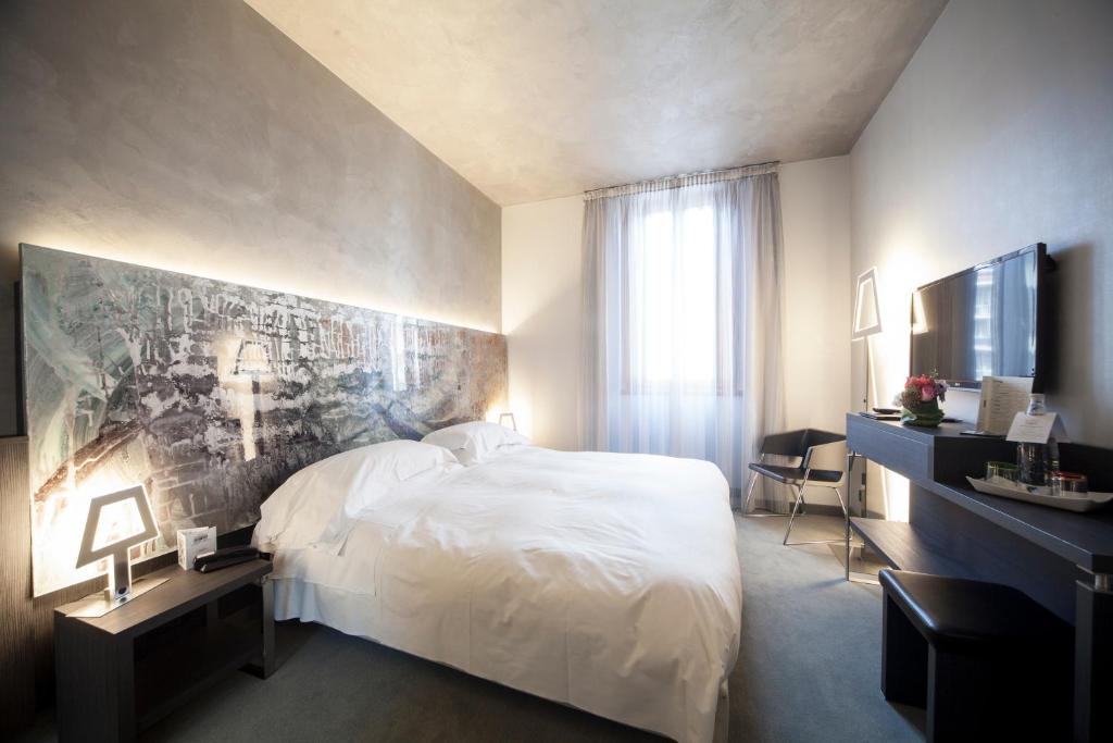 Postel nebo postele na pokoji v ubytování Arli Hotel Business and Wellness