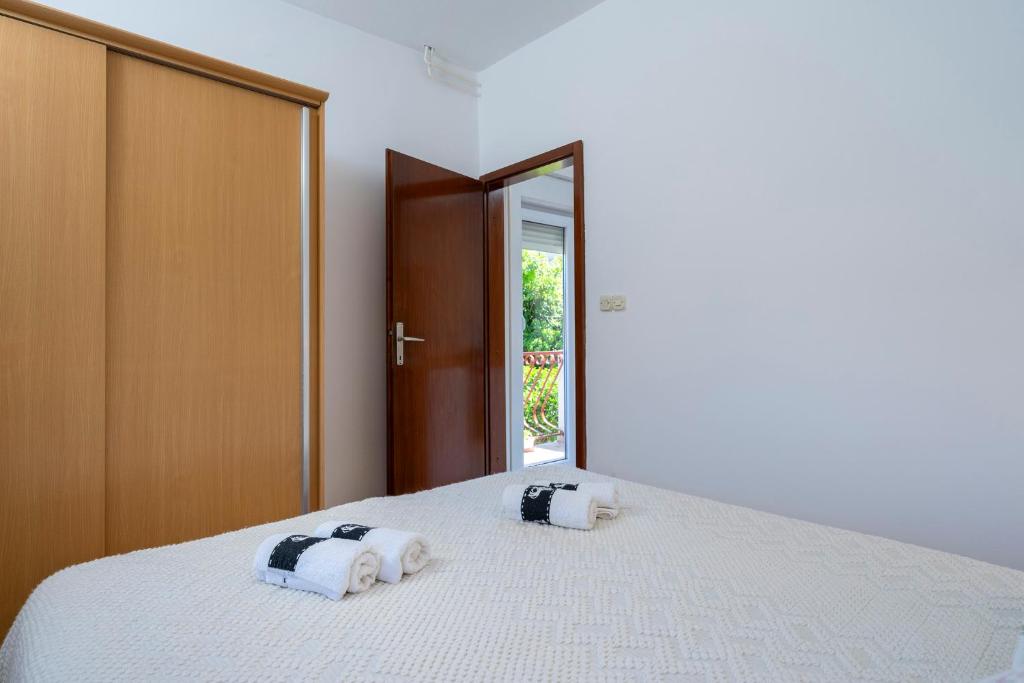 Posteľ alebo postele v izbe v ubytovaní Apartments Draganic