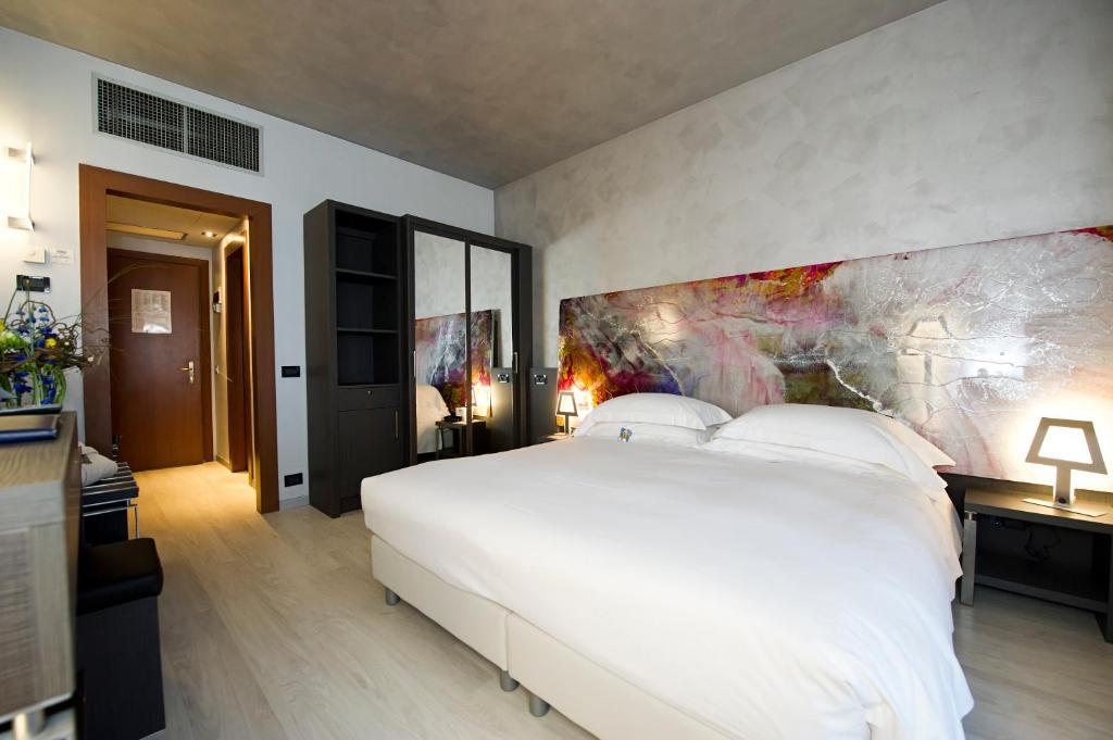 Postel nebo postele na pokoji v ubytování Arli Hotel Business and Wellness