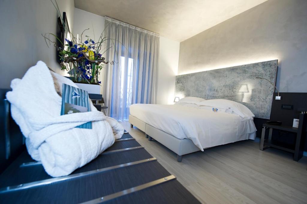 Postel nebo postele na pokoji v ubytování Arli Hotel Business and Wellness