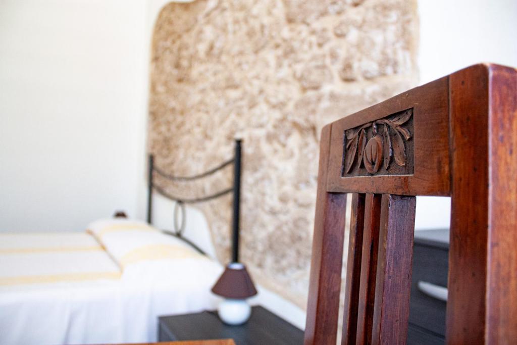 Postel nebo postele na pokoji v ubytování Poseidon Alghero