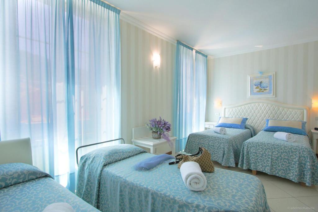 Posteľ alebo postele v izbe v ubytovaní Hotel Nazionale