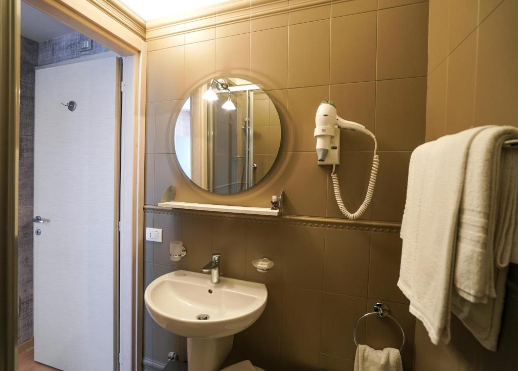 a bathroom with a sink and a mirror at Sole Mare in Ventimiglia